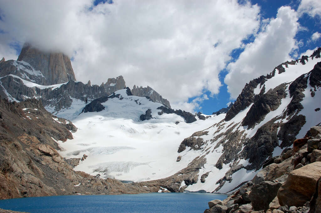 A small lake with steep mountainsides on every side.