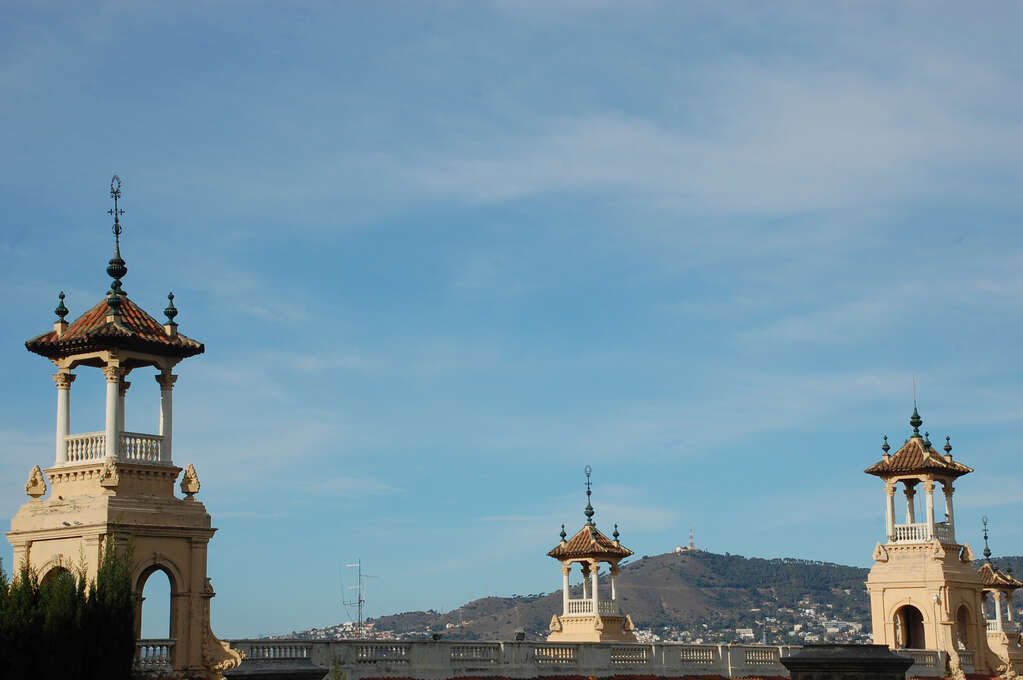 Four decorative towers spaced unevenly.