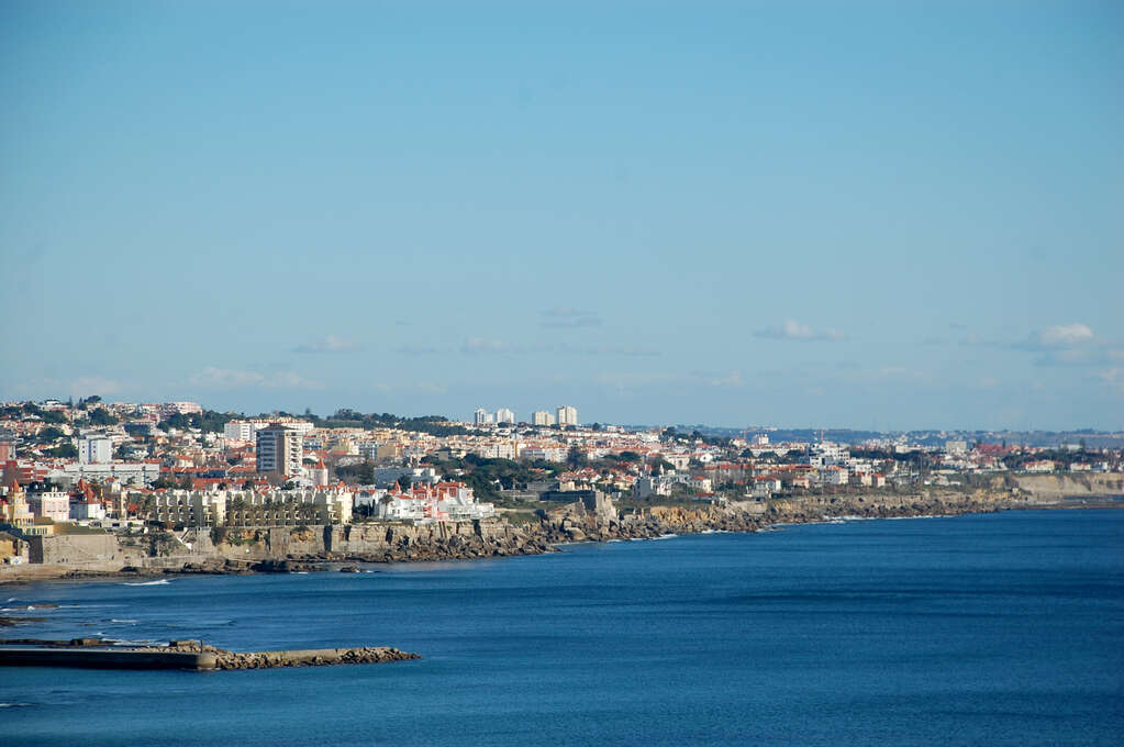 A town across the bay in bright daylight.