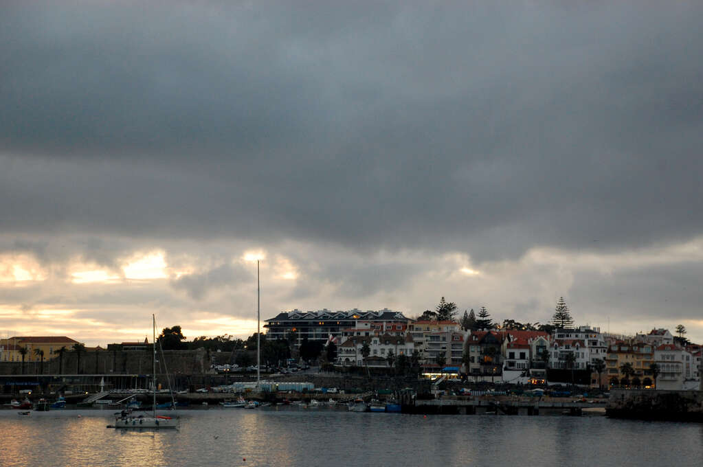 A town across a small bay in the morning.