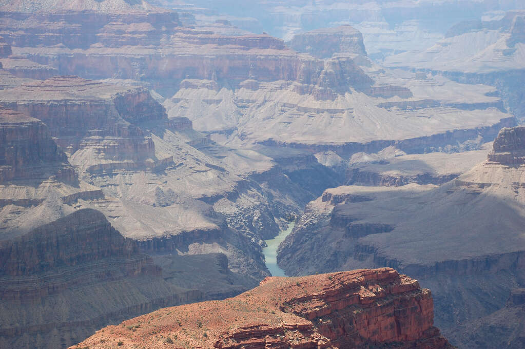 The canyon extending into the distance with a river running along the bottom.