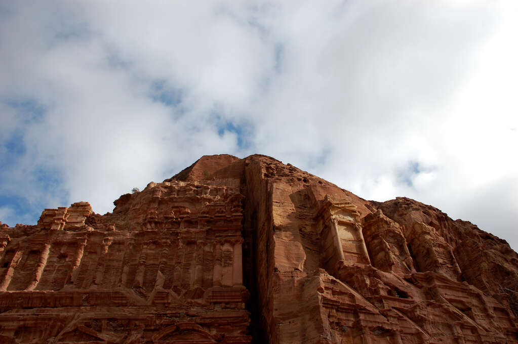 Carved pillars and designs in a mountainside.