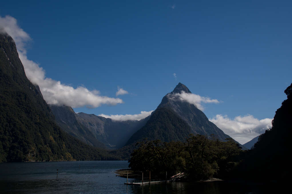 A lake surrounded by tall mountains.